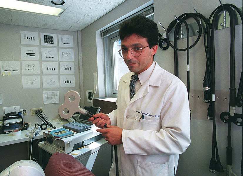 Alvaro Pascual-Leone holding early TMS device Photograph of neuroscientist Alvaro Pascual-Leone, a pioneer of TMS treatment, holding an early TMS device in the 1990s.