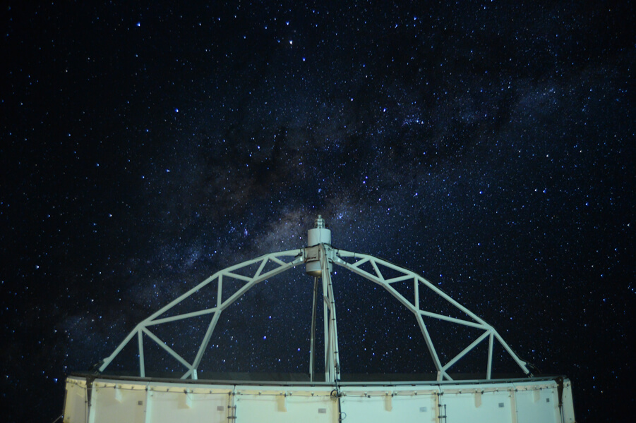 APEX telescope Photo shows the dish of the APEX telescope directed toward the night sky.