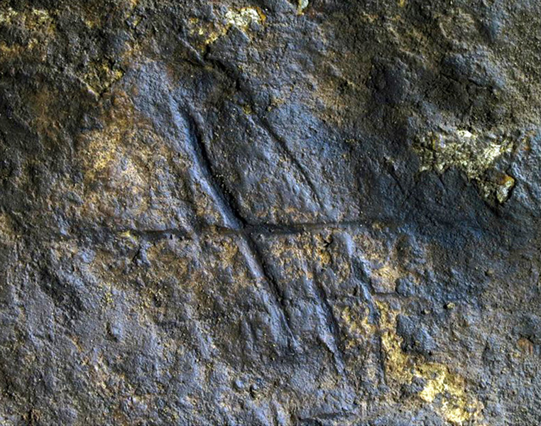 Neanderthal hashtag Rock with deep grooves carved into it. It looks like a hashtag.