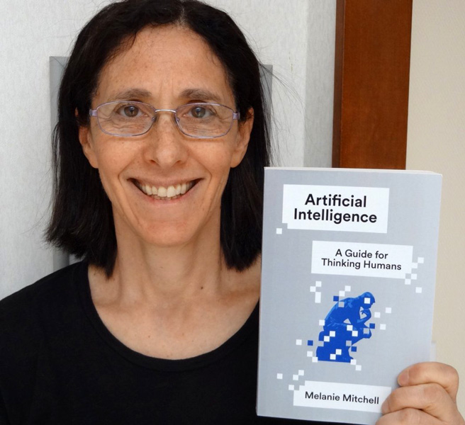Melanie Mitchell Photo shows Melanie Mitchell with a copy of her book.